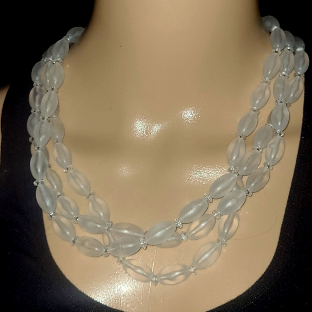 CLEAR OVAL BEADED TRIPLE STRANDED CLASPED NECKLACE